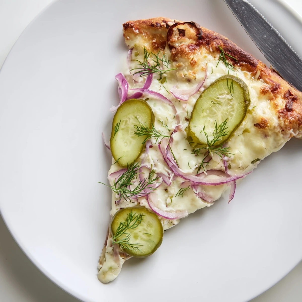 Unique Pickle Pizza with bubbling cheese and zesty pickles for adventurous eaters.