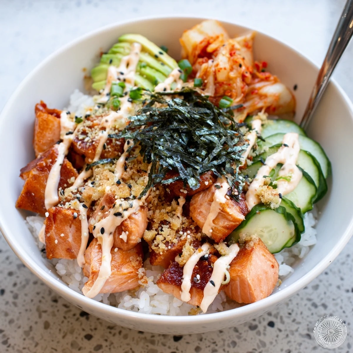 Deliciously golden crispy salmon on a bed of fluffy rice and vibrant veggies.  