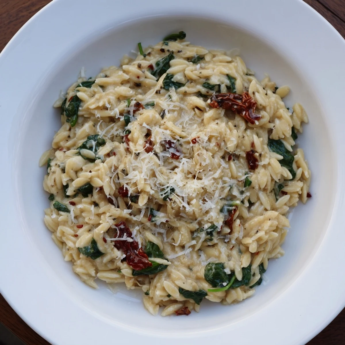 Enjoy a hearty vegetarian Creamy Tuscan Orzo Bowl; a delicious Italian-inspired pasta dish.