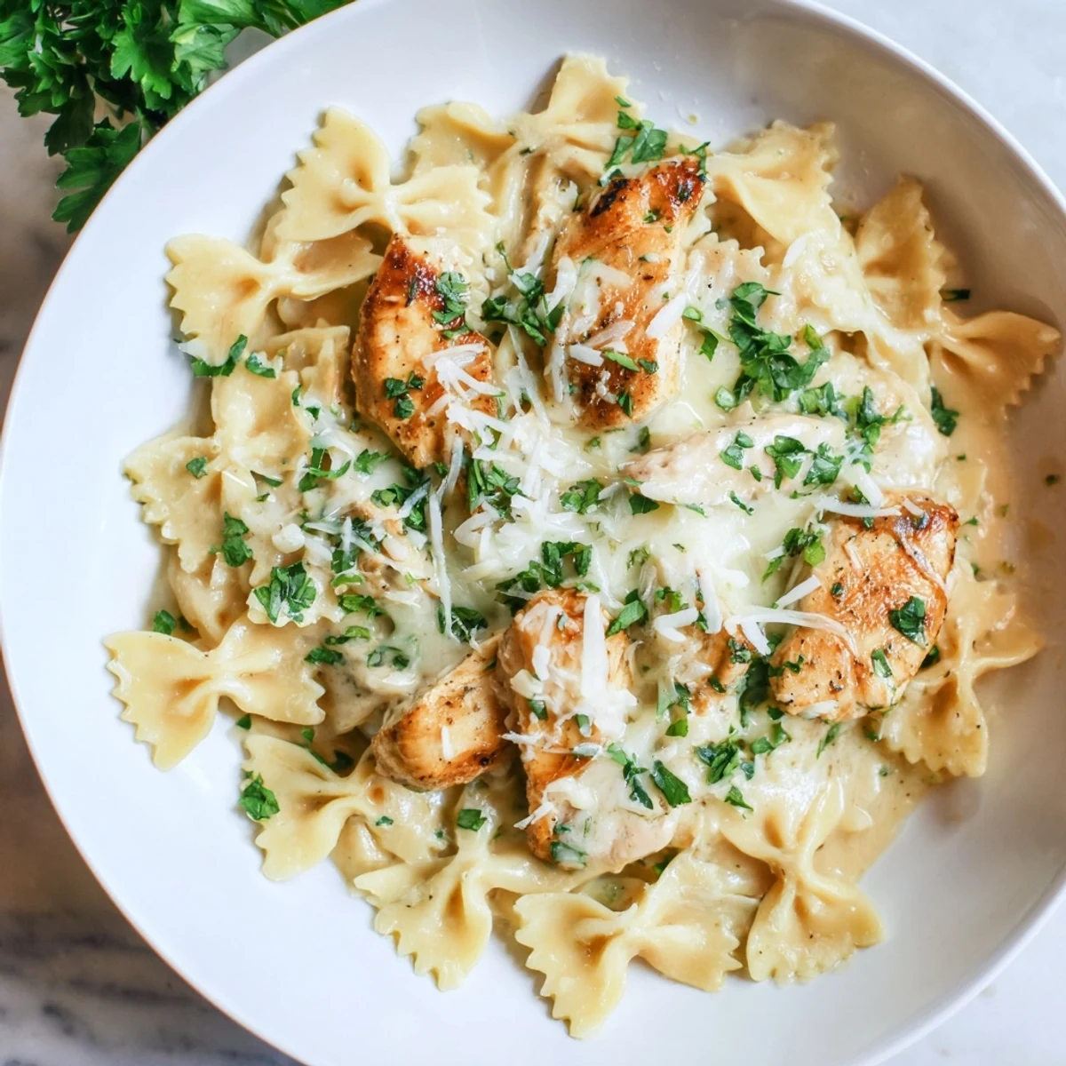 Creamy mozzarella garlic butter chicken bowties, a flavorful Italian-American dish with tender chicken pieces.