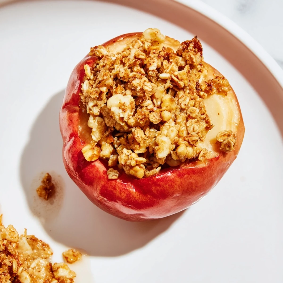 The baked, tender apples are filled with sweet, crunchy Oat-Nut Crumble for a delicious treat.