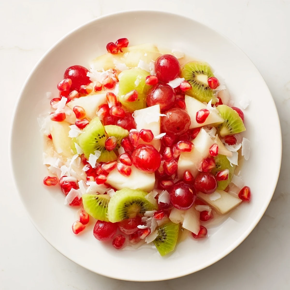 Refreshing Snowflake Fruit Medley with bright red pomegranate and juicy orange segments.
