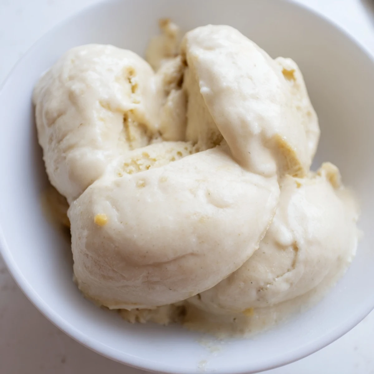 Close-up of freshly blended 2-Ingredient Banana Ice Cream, ready to scoop and enjoy.
