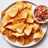 Close-up of freshly made air-fryer tortilla chips, perfect for dipping into a flavorful salsa.