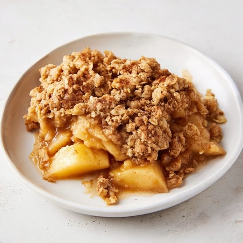 Golden, bubbly apple crisp with warm, tender apples and a sweet oat crumble topping.