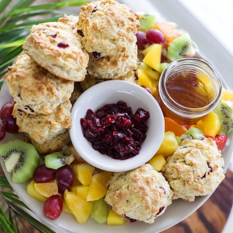 A delightful Breakfast Brunch Board Bliss, with golden mini pancakes and fresh fruit arranged beautifully.