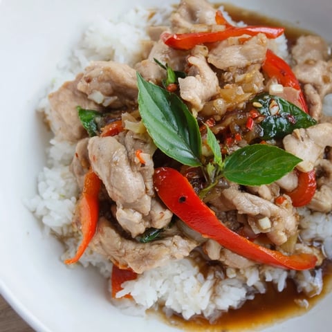 Vibrant Thai Basil Chicken Bowls, stir-fried with rich aromas, served atop fluffy jasmine rice.
