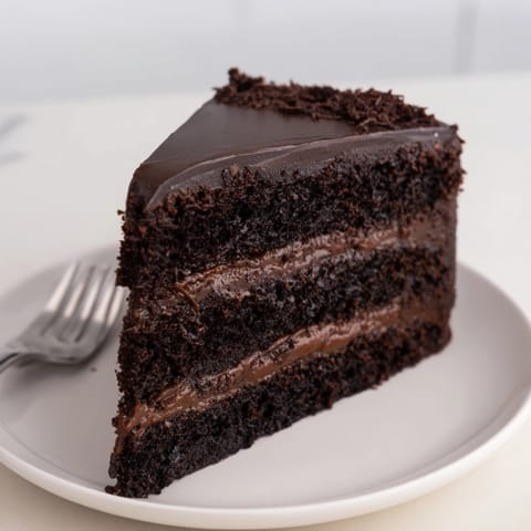 Homemade chocolate ganache cake recipe; fluffy layers and silky, irresistible ganache frosting.