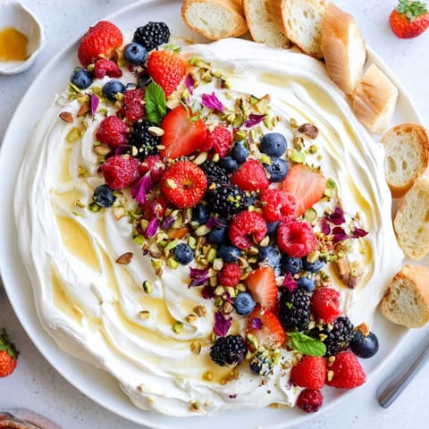 Whipped cream cheese butter board dessert served with toasted brioche slices.  