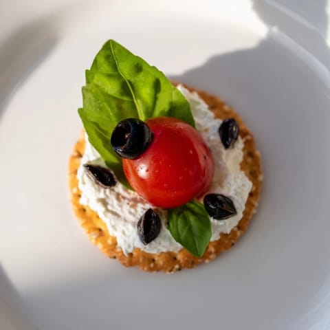 Vibrant Ladybug Love Picnic Finger Foods: See the basil, tomato, and olive ladybugs artfully arranged.