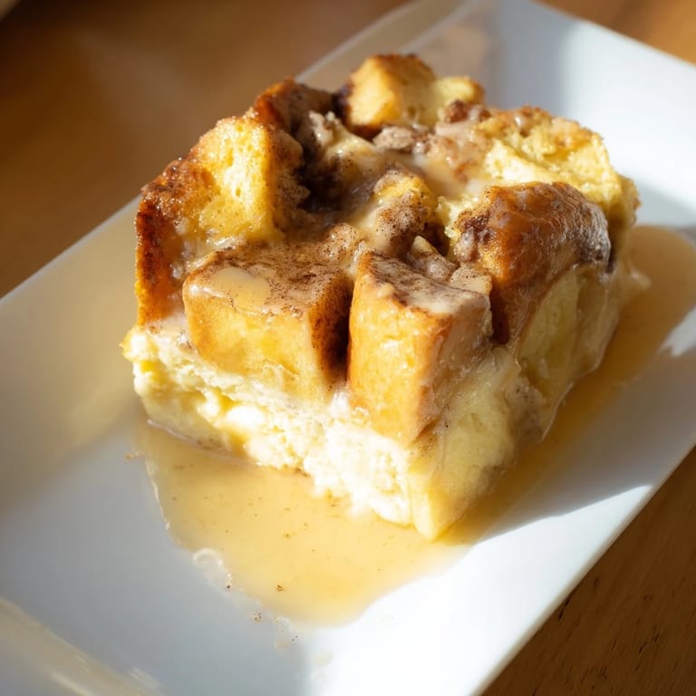 This delicious French toast bake presents a custardy, baked bread pudding, topped with a sweet cinnamon crust.