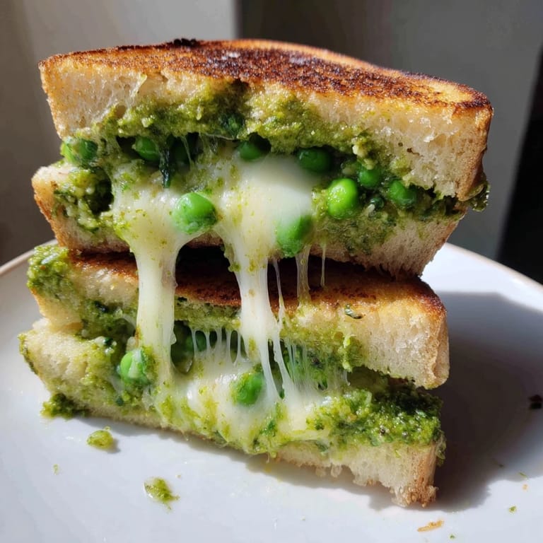 Crisp, buttery grilled cheese layered with bright spring pea pesto and fresh mozzarella.
