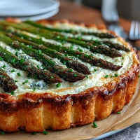 Asparagus Ricotta Tart with crisp golden pastry, creamy ricotta filling, and tender asparagus spears baked to perfection.